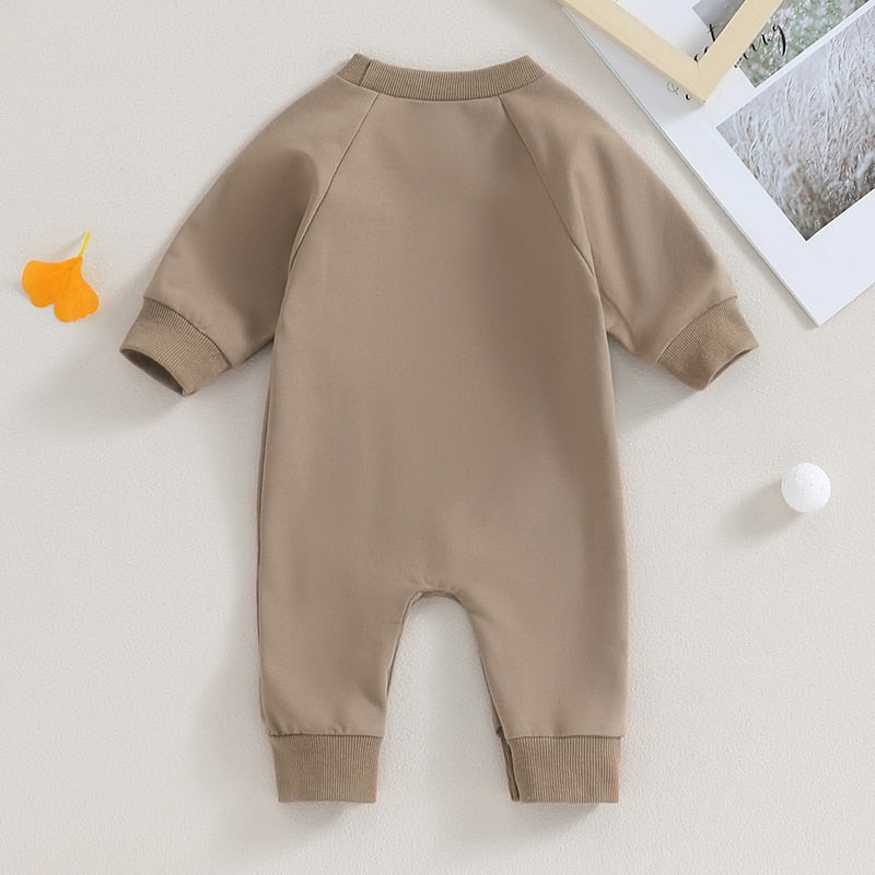 Baby boy and girl romper by August + Willow featuring western bull head and letter print, long sleeves, perfect for fall.