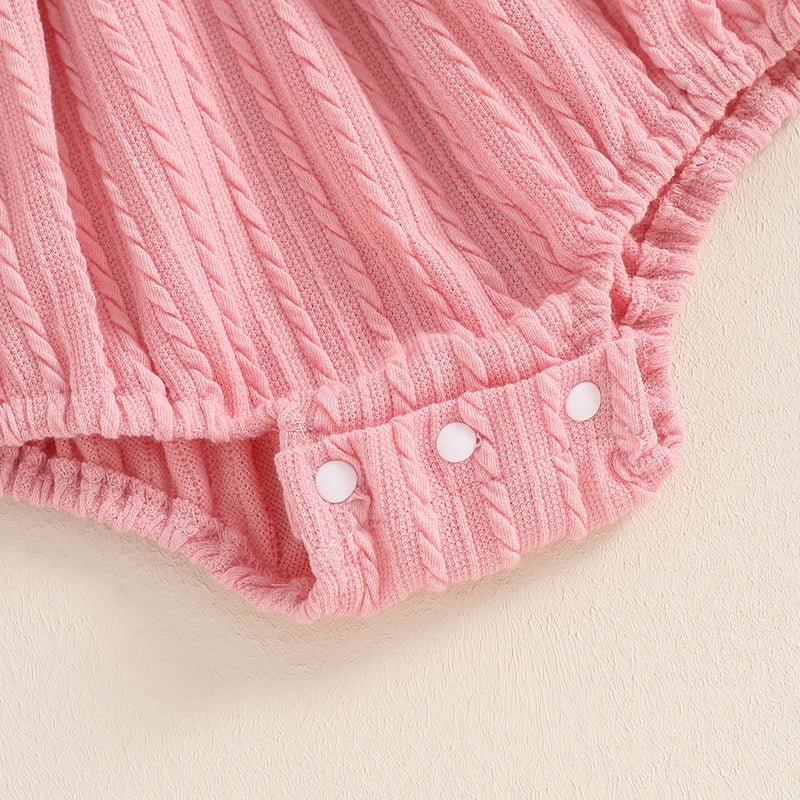 Baby girls pink 2-piece set with lace ruffled trim, ribbed long sleeve romper, and matching bow headband by August + Willow.