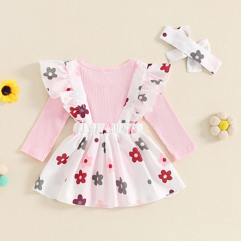 Baby girl fall outfit set with pink long-sleeve ribbed romper, floral skirt with suspenders, and headband from August + Willow.