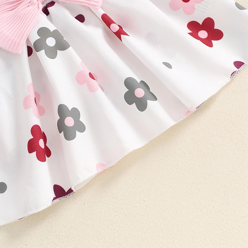 Baby girls fall outfit set by August + Willow with a pink long-sleeve ribbed romper, flower skirt, bow suspender, and headband.
