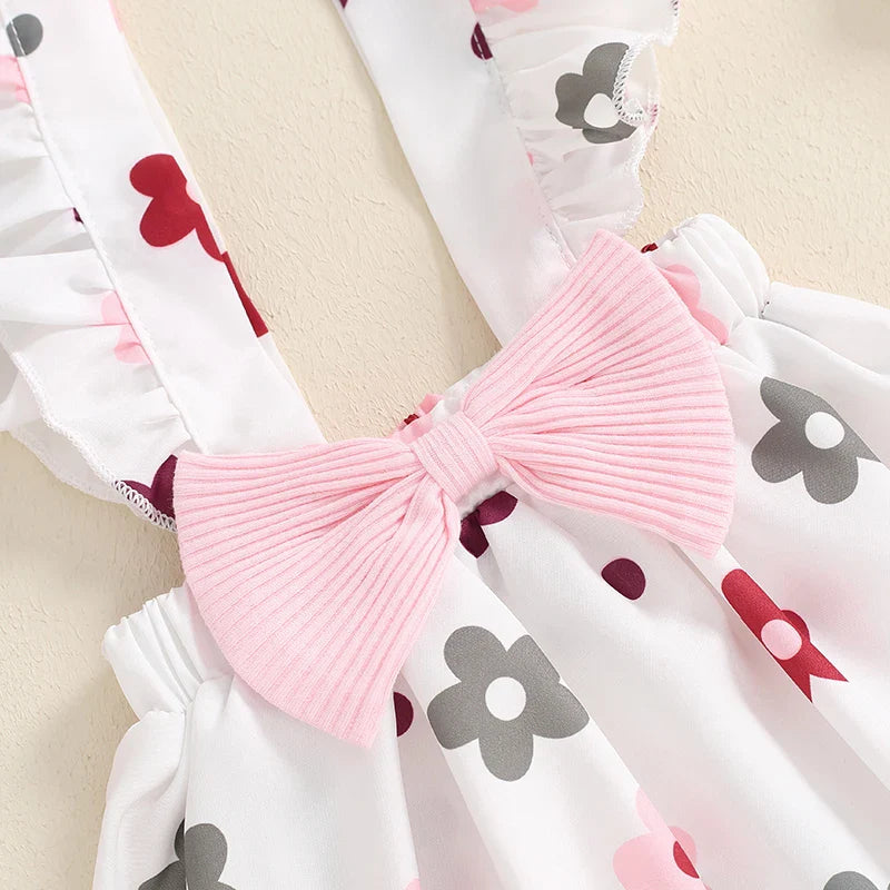 Baby girls 3-piece fall outfit set with ribbed romper, floral skirt with suspenders, and headband from August + Willow.