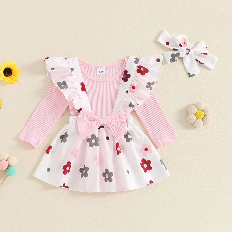 Baby girls fall outfit set with pink long sleeve ribbed romper, flower print skirt, bow suspender, and headband by August + Willow.