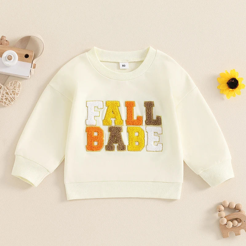 Pink baby and toddler fall crewneck top by August + Willow with embroidered letters, long sleeves, perfect for boys and girls.