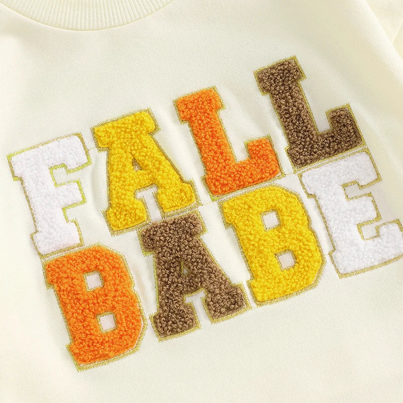 Pink fall crewneck top for baby and toddler from August + Willow, featuring embroidered letters and long sleeves.