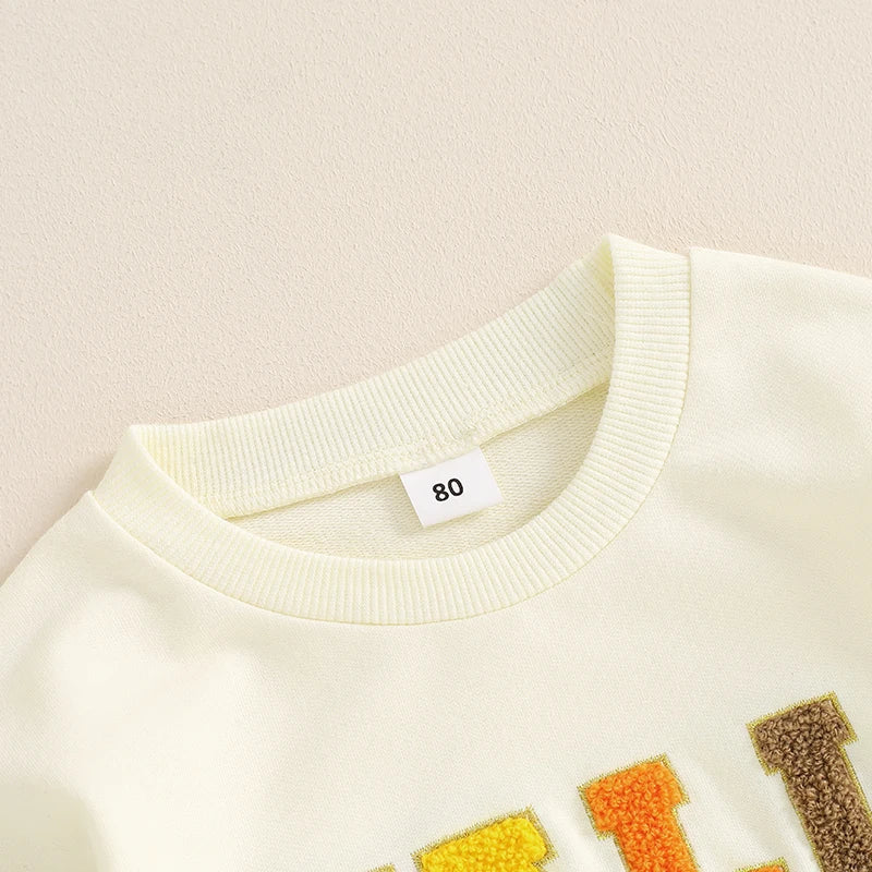 Pink fall crewneck top for baby and toddler girls and boys by August + Willow with embroidered letters and long sleeves.