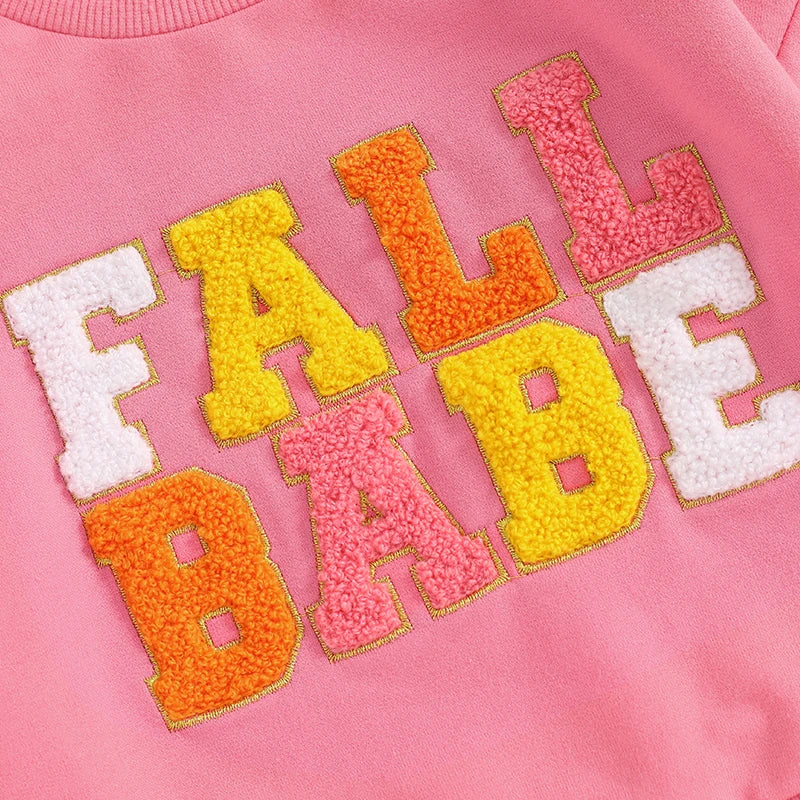 Pink baby and toddler fall crewneck top by August + Willow with embroidered letter details, long sleeves, perfect for boys and girls.