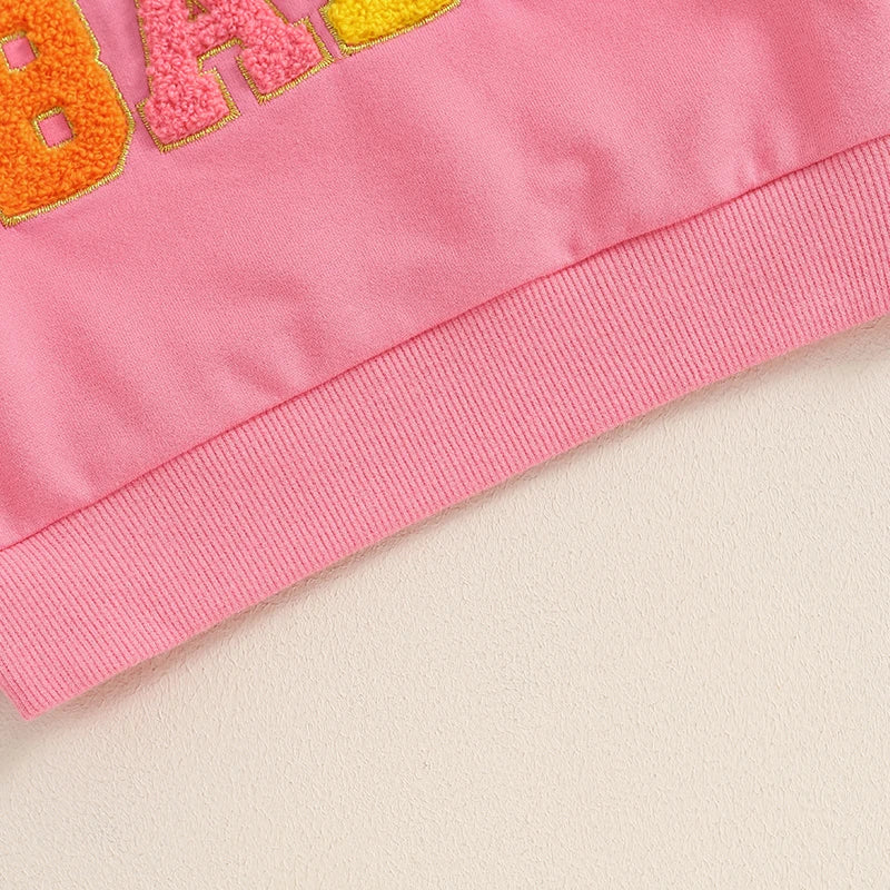 Pink baby and toddler fall crewneck top with embroidery letters from August + Willow, long sleeves, suitable for boys and girls.