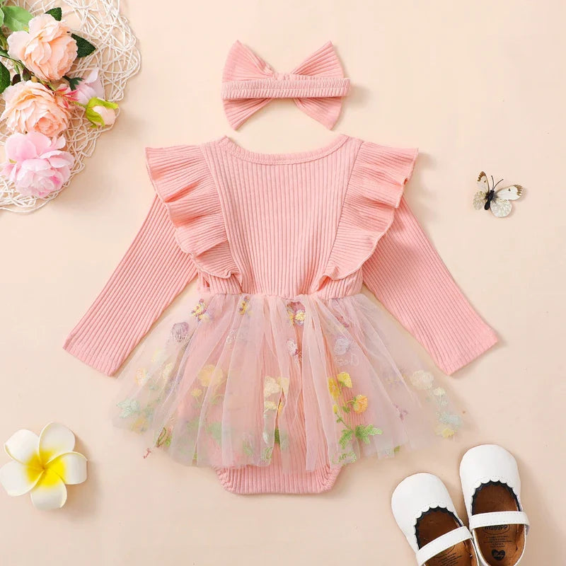 Cute baby girl 2-piece outfit with floral mesh ruffles, long sleeve romper, tutu skirt, and matching headband by August + Willow.