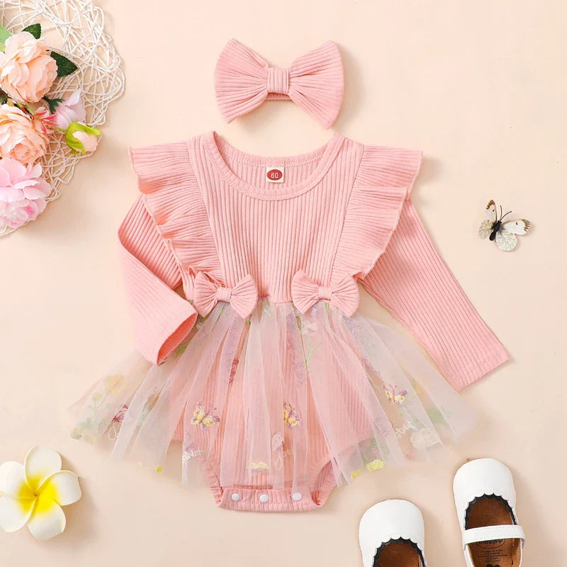 Baby girl 2-piece outfit with floral mesh ruffles, long sleeve romper, tutu skirt, and matching headband from August + Willow.