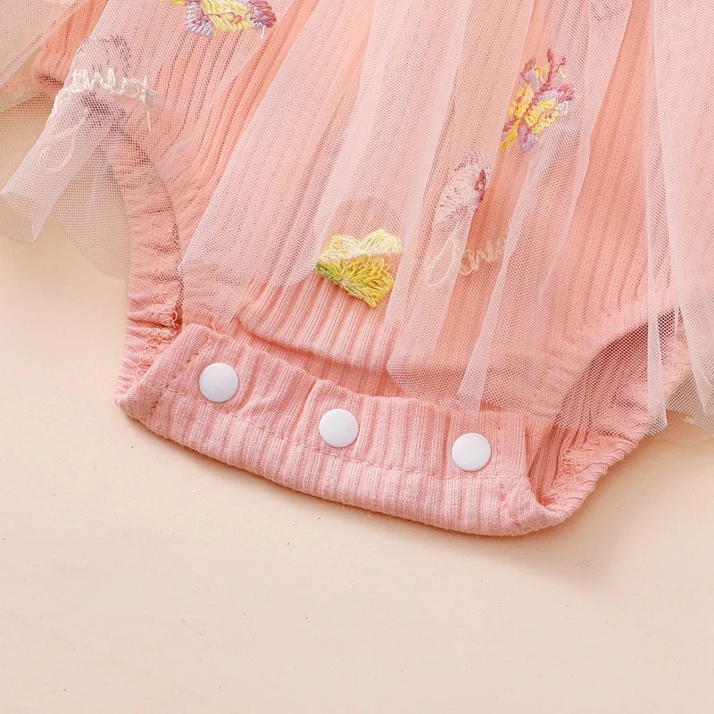 Baby girl 2-piece outfit with floral mesh ruffle romper, dress, tutu, and headband from August + Willow.