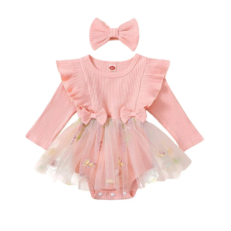 Baby girl 2-piece outfit by August + Willow with floral mesh ruffles, long sleeve romper, tutu skirt, and matching headband.