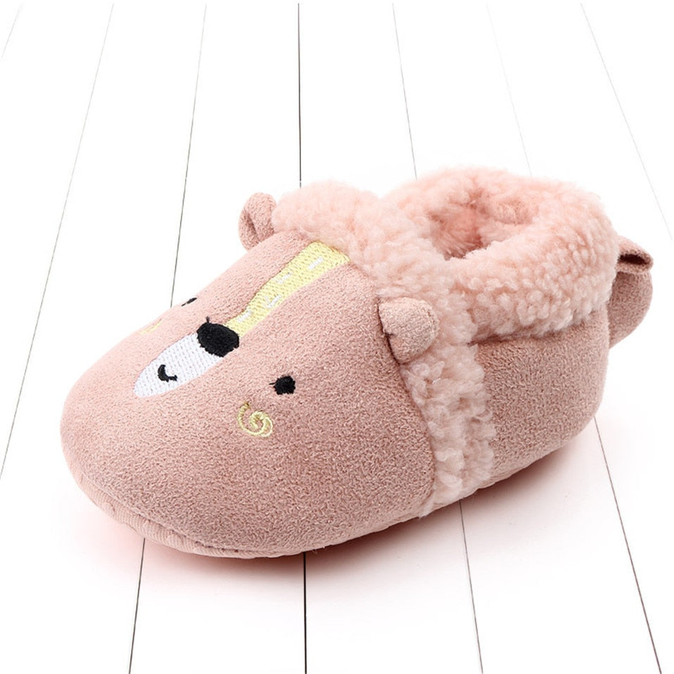 Pink penguin baby slippers for newborns and infants, anti-slip animal-themed first walker shoes by August + Willow.