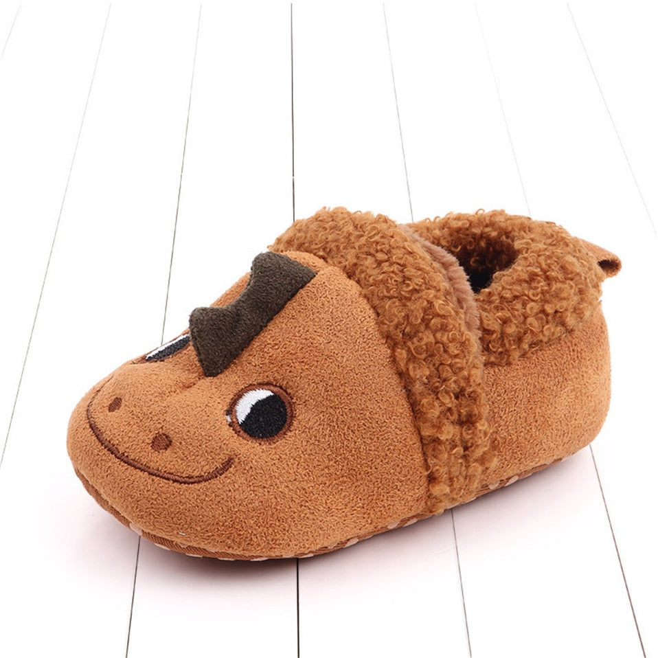Pink animal slippers for newborns and infants with anti-slip soles, designed by August + Willow for first walkers.
