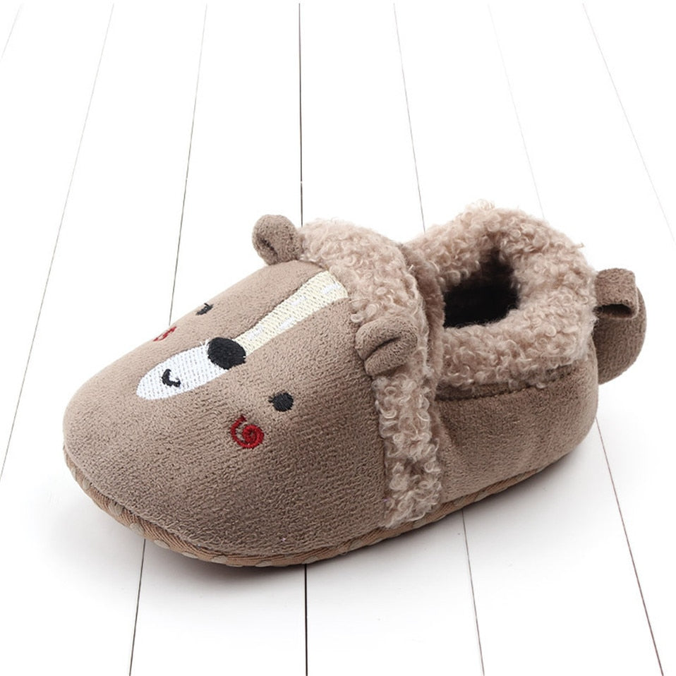 Pink penguin baby slippers for newborns and infants, anti-slip animal-themed shoes perfect for first walkers by August + Willow.