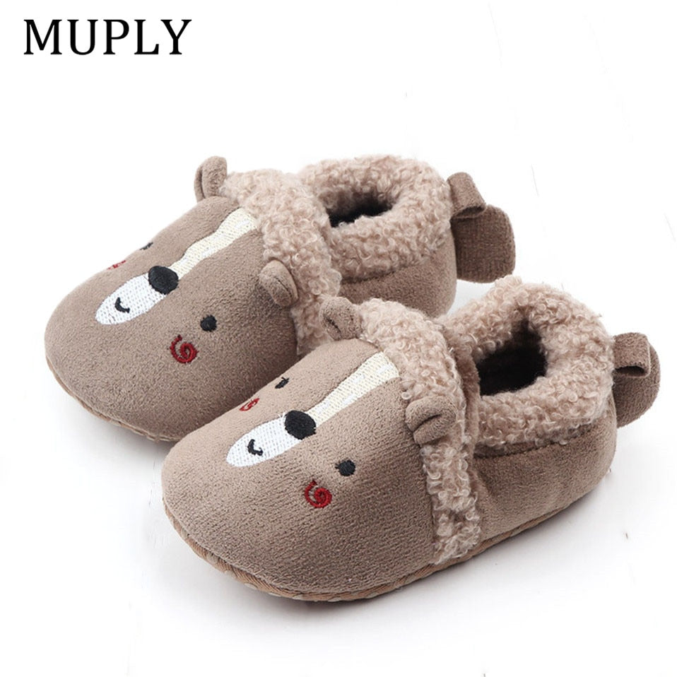 Pink penguin baby shoes by August + Willow, anti-slip first walker slippers for newborns and infants in 0-6 months.