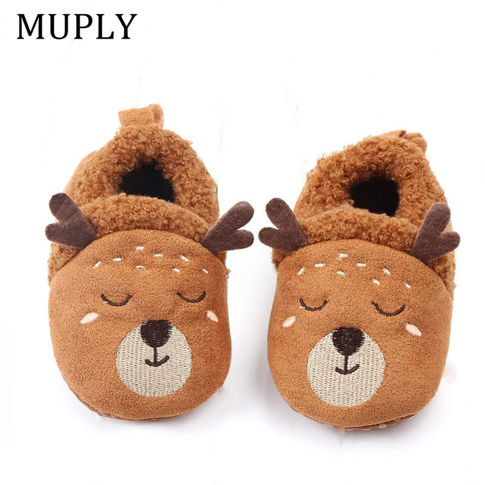 Pink baby slippers with animal design, anti-slip soles, suitable for newborns and first walkers, by August + Willow.