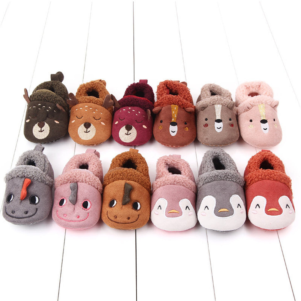 Pink penguin baby shoes for newborns and infants with anti-slip soles, designed as first walker animal slippers by August + Willow.