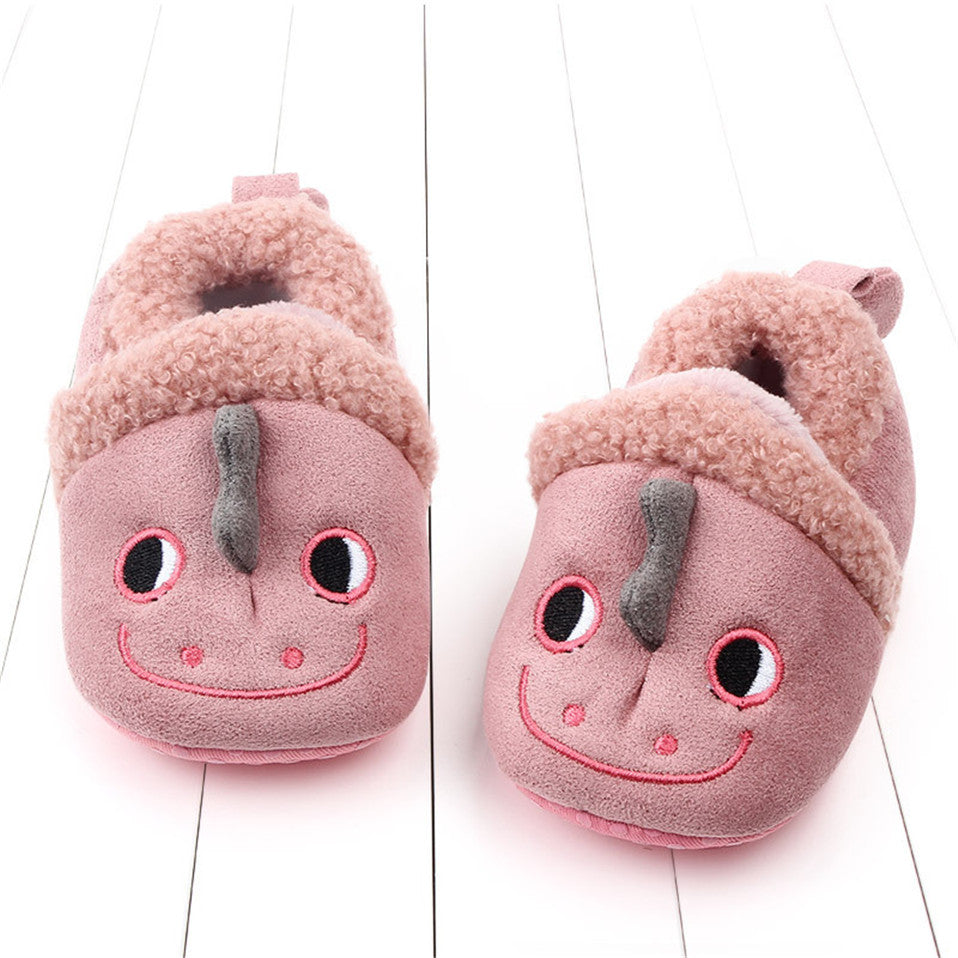 Pink penguin baby shoes by August + Willow, anti-slip first walker slippers for newborns and infants, designed for safety and comfort.