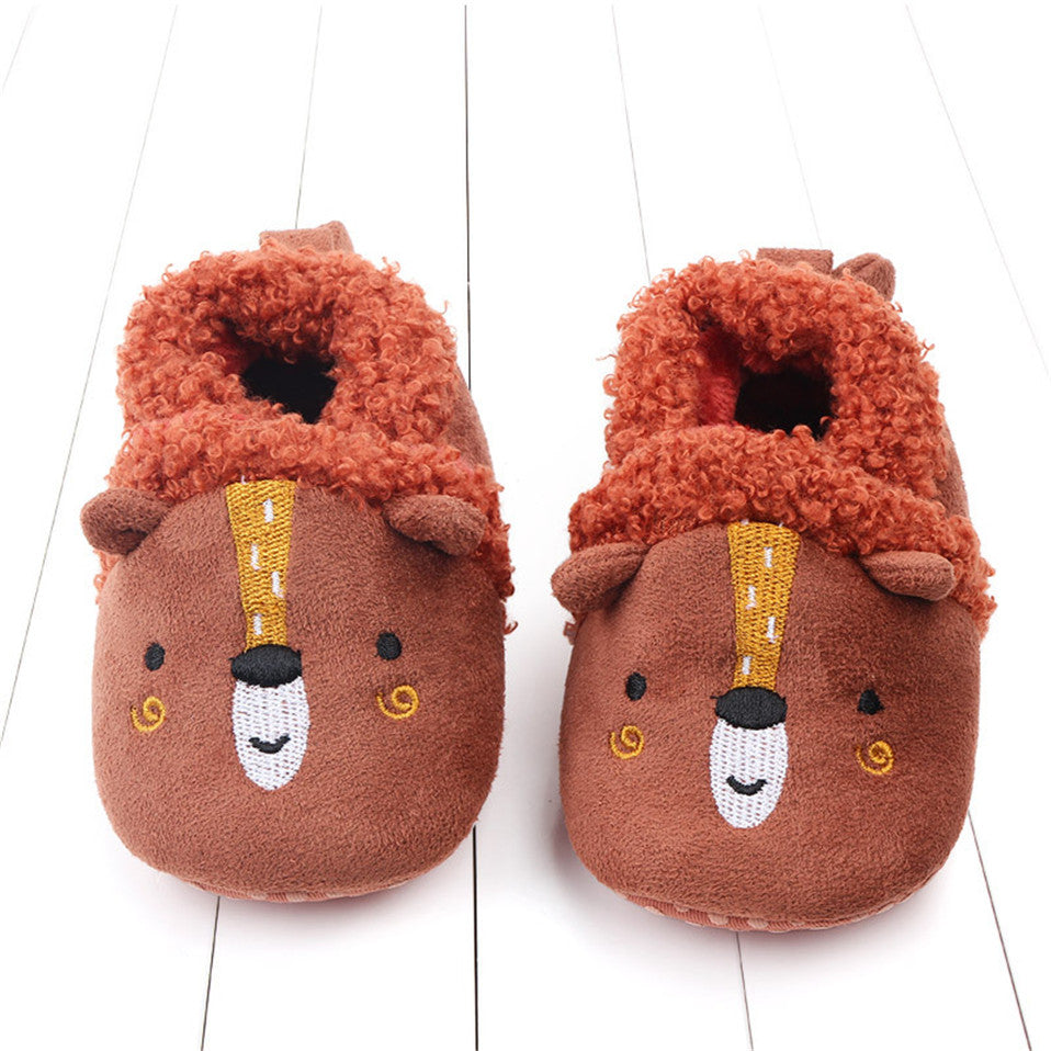 Pink penguin baby slippers for newborns and infants, anti-slip first walker animal shoes by August + Willow.