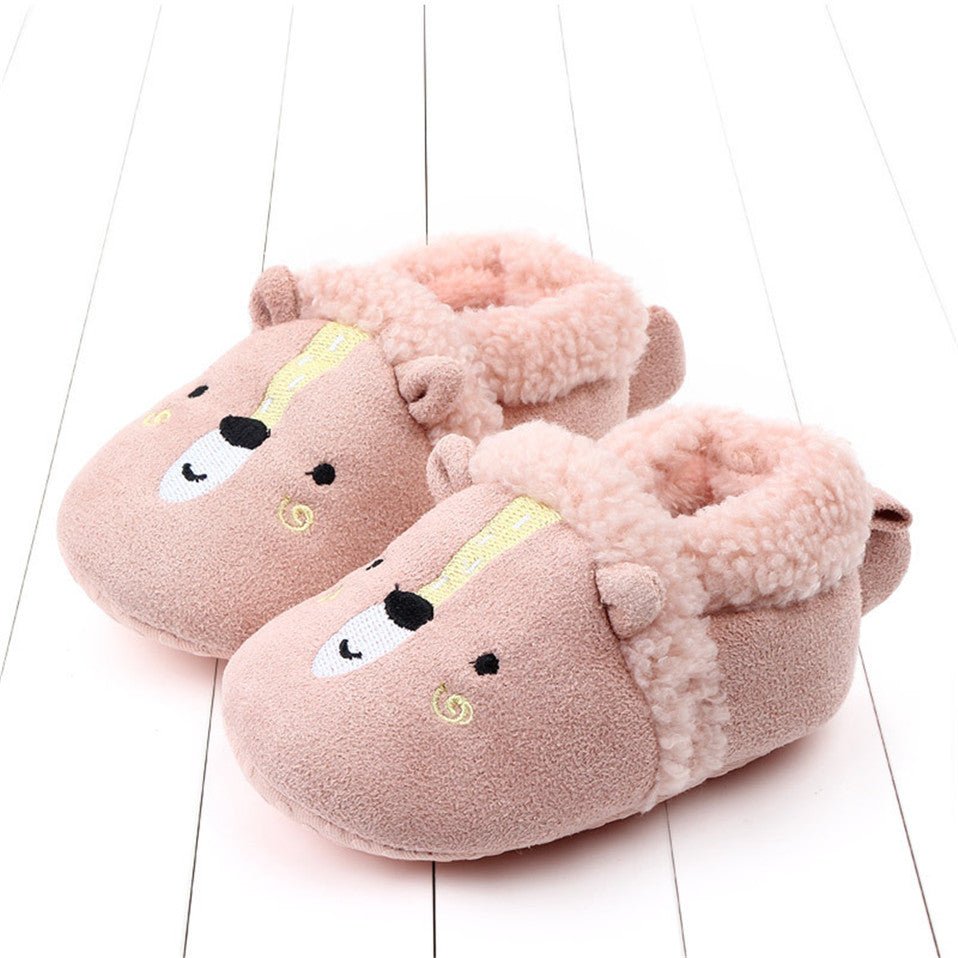 Pink penguin baby slippers for newborns, anti-slip first walker shoes from August + Willow, suitable for infants 0-6 months.
