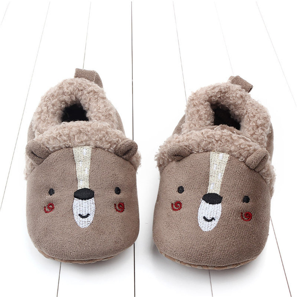 Pink penguin baby slippers for infants, anti-slip first walker shoes from August + Willow, designed for newborns and toddlers.