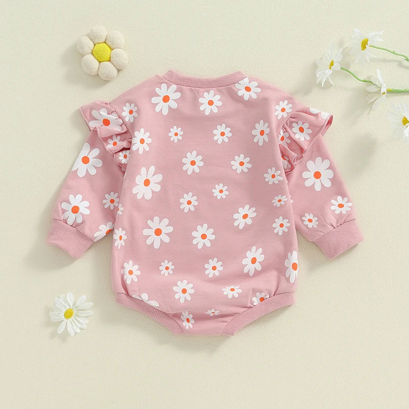 Baby girl bubble romper by August + Willow with daisy flower print, long sleeves, round neck, perfect for toddlers aged 6-12 months.