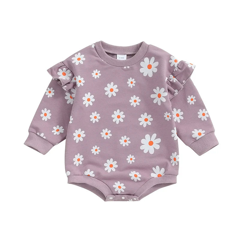 Baby girl bubble romper by August + Willow with daisy print, long sleeves, round neck, and comfortable fit for 6-12 months.