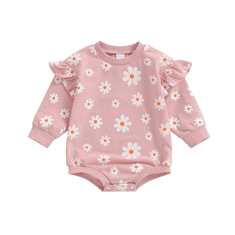 Baby girl in a purple Daisy print bubble romper with long sleeves and round neck, from August + Willow baby toddler outfits.
