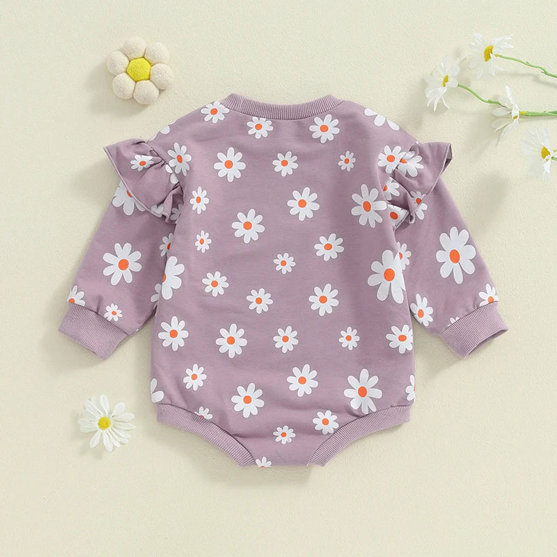 Baby girl bubble romper by August + Willow, purple daisy flower print, long sleeve, round neck, toddler outfit for 6-12 months.