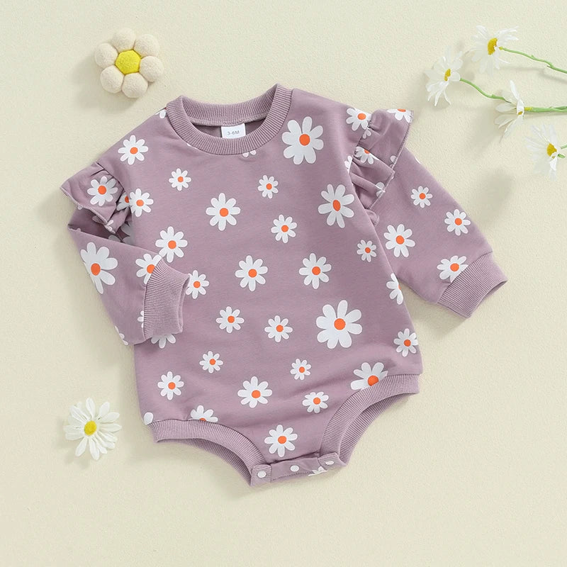 Baby girl bubble romper by August + Willow with daisy flower print, long sleeves, round neck, suitable for 6-12 months.