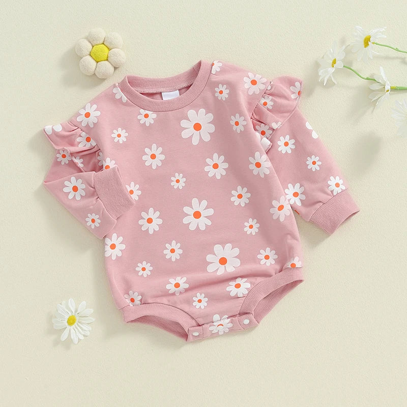 Baby girl bubble romper by August + Willow with purple daisy print, long sleeves, round neck, suitable for 6-12 months.