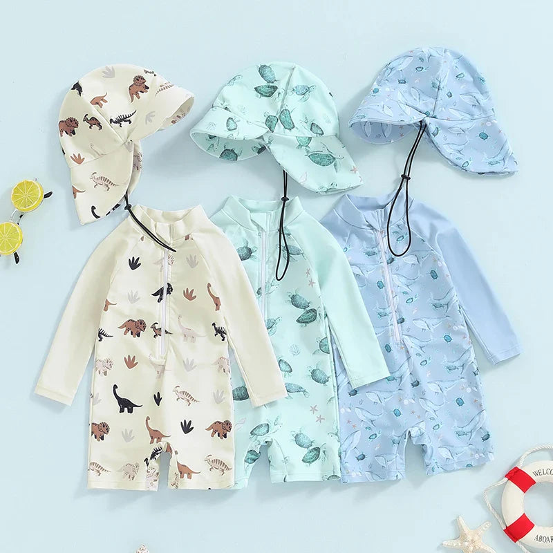 Baby toddler boy 2-piece swimwear set with dinosaur, turtle, and whale print, long sleeves, sun hat, by August + Willow.