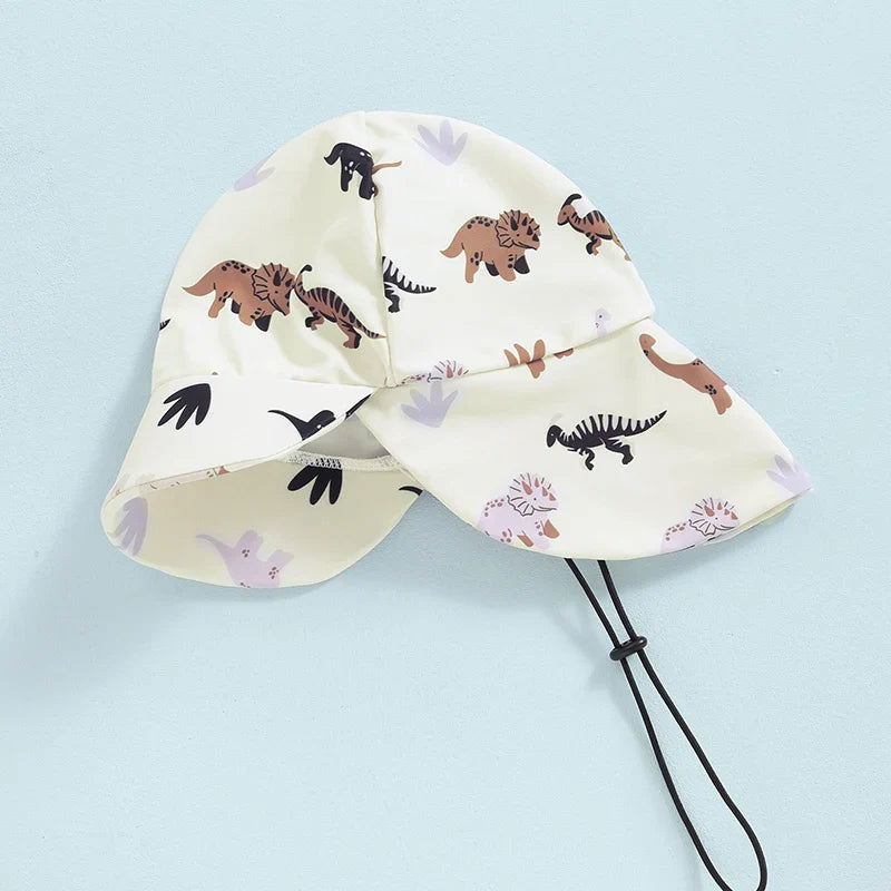 Baby boy 2-piece swimwear set with dinosaur, turtle, and whale print, includes long-sleeve swimsuit and sun hat, August + Willow.