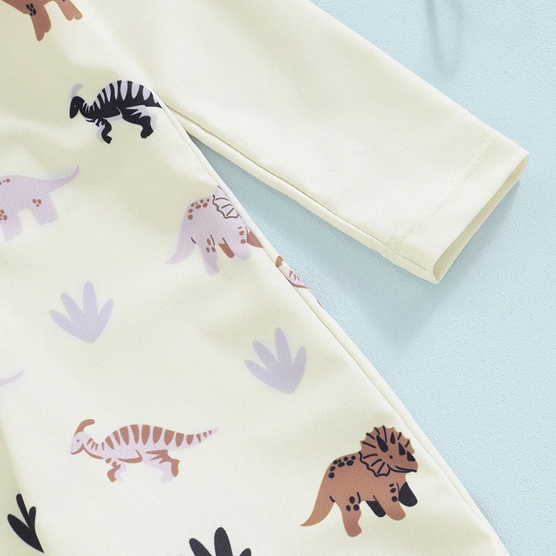 Baby boy toddler 2-piece swimwear set with dinosaur, turtle, and whale prints, including long sleeve swimsuit and sun hat by August + Willow.