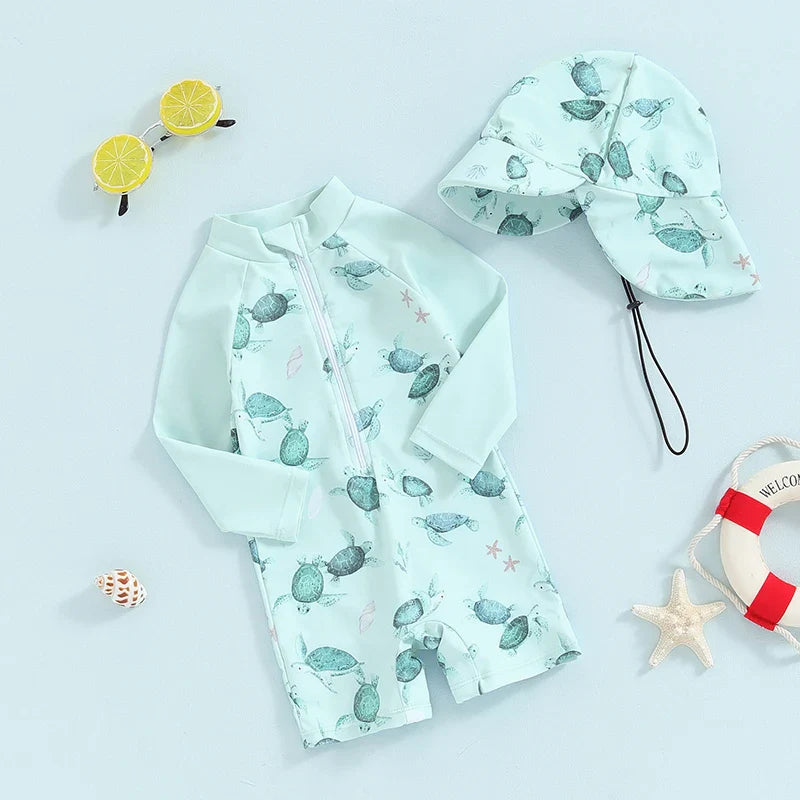 Baby boy toddler 2-piece swimwear set with dinosaur, turtle, and whale prints, long sleeves, sun hat, made by August + Willow.
