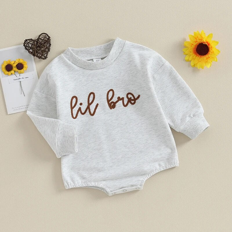 Baby boy long sleeve crewneck top by August + Willow with "Big Lil Bro" letters, perfect for toddler matching outfits.
