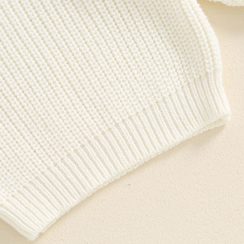 Baby girl birthday sweater by August + Willow with floral embroidery, letter details, long sleeves, and cozy knitwear for infants.