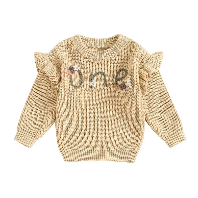 Baby girl birthday sweater by August + Willow featuring floral embroidery, letter details, long sleeves, and warm knit fabric.