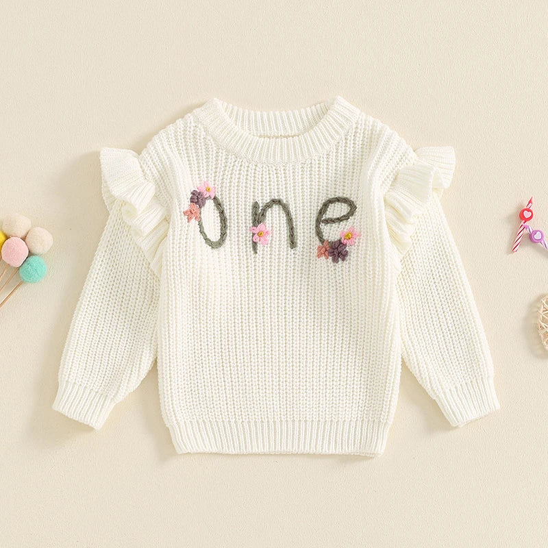 Baby girl birthday sweater by August + Willow with floral embroidery, long sleeves, and letter details, cozy knitwear for infants.