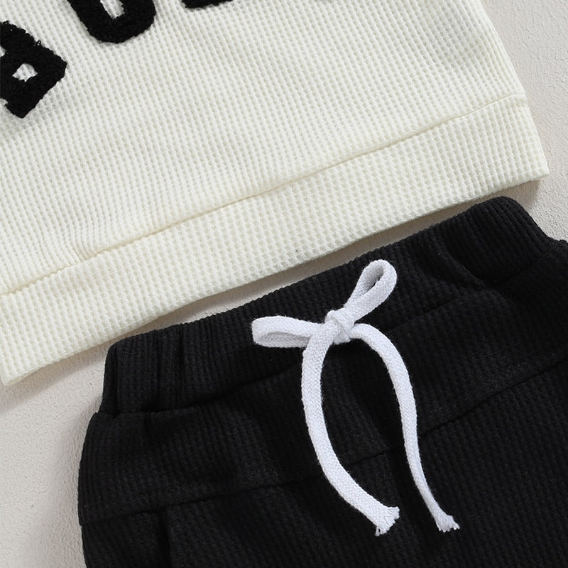 Baby and toddler boys and girls 2-piece long sleeve letter embroidery bubs tops with drawstring pants set by August + Willow.