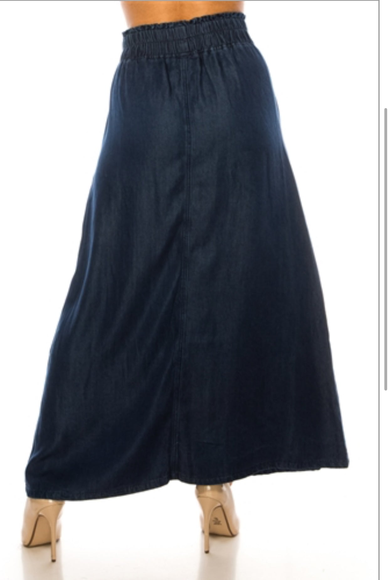 Be-Girl dark denim maxi skirt with elastic sack waist and flowing style, displayed on a hanger.