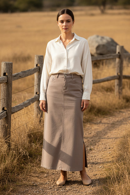 Be-Girl denim twill maxi skirt in stone color, featuring a flowing design and waistband, shown on a model.