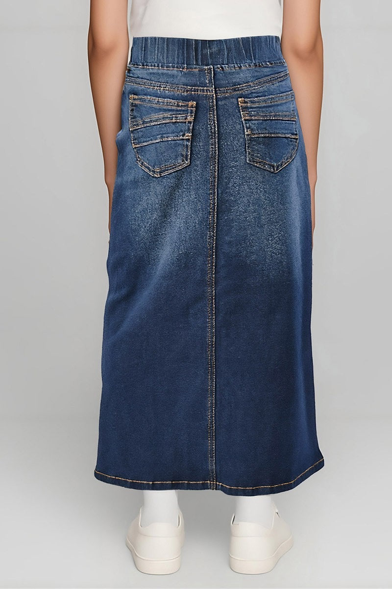 Girls denim maxi skirt by Be-Girl with an elastic waistband in dark wash, featuring a flowing style and casual design.