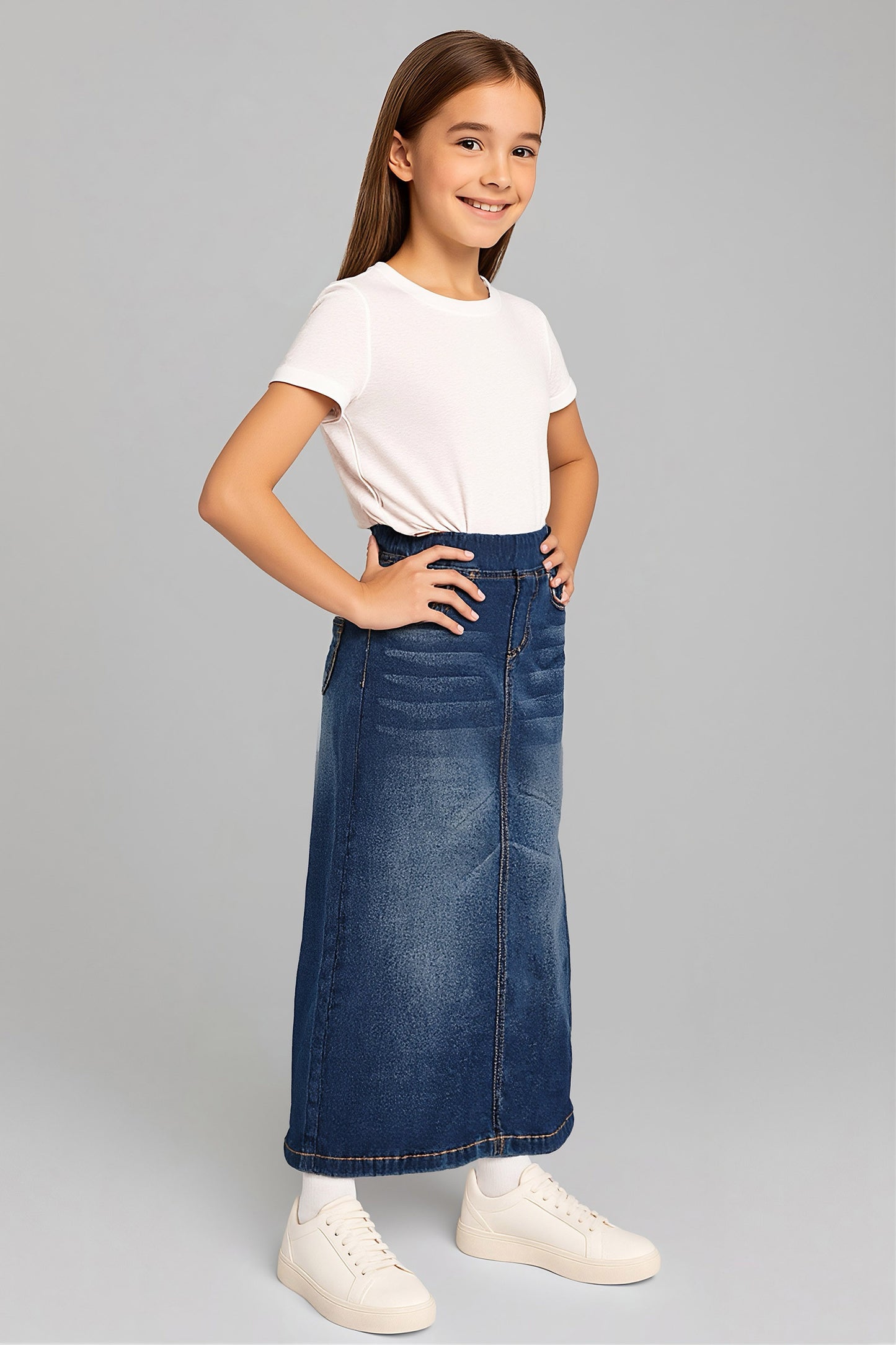 Girls denim maxi skirt with elastic waistband in dark wash, by Be-Girl, featuring a flowy style and comfortable fit.
