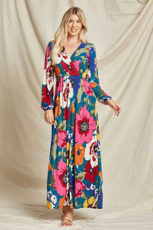 Pink floral faux wrap maxi dress by Beeson River featuring a surplice neckline and flowing silhouette.