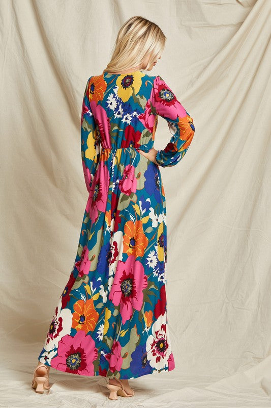 Pink floral faux wrap maxi dress by Beeson River featuring surplice neckline and flowing silhouette.