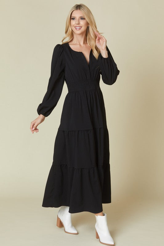 Beeson River solid maroon tiered V-neck maxi dress with pockets, displayed on a model.