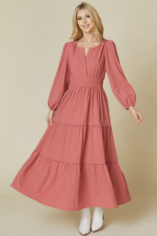 Beeson River solid maroon tiered V-neck maxi dress with pockets, flowing design, and short sleeves, shown on a model.