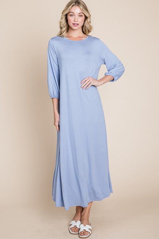 Bombom Cloud Blue A-line puff sleeve maxi dress with a flowy silhouette and elegant design, perfect for stylish occasions.