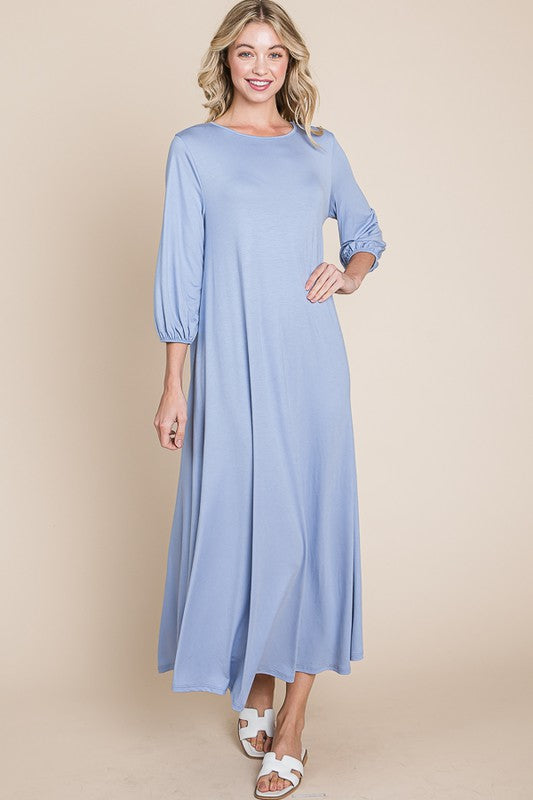 Bombom Cloud Blue A-line Puff Sleeve Maxi Dress with elegant flowing fabric and stylish puffed sleeves.